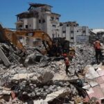 Bu binanin enkazindan iki aileye ait 99 cenaze cikarildi QpvDmAYz